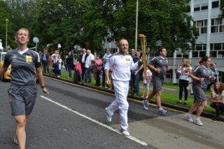Torch bearer Tom Isaacs in Digswell Road | Robert Gill